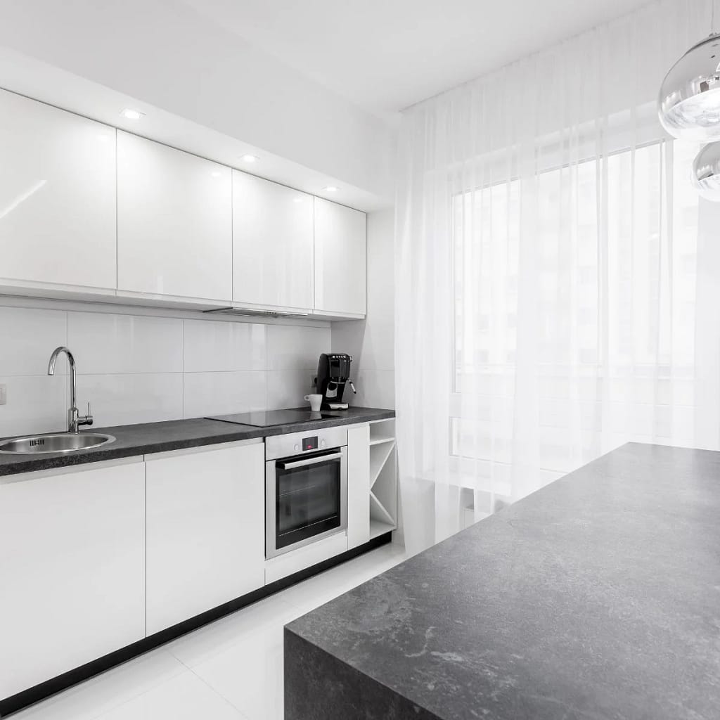 Granite Large Dark Granite Isaldn And Worktops in White Kitchen