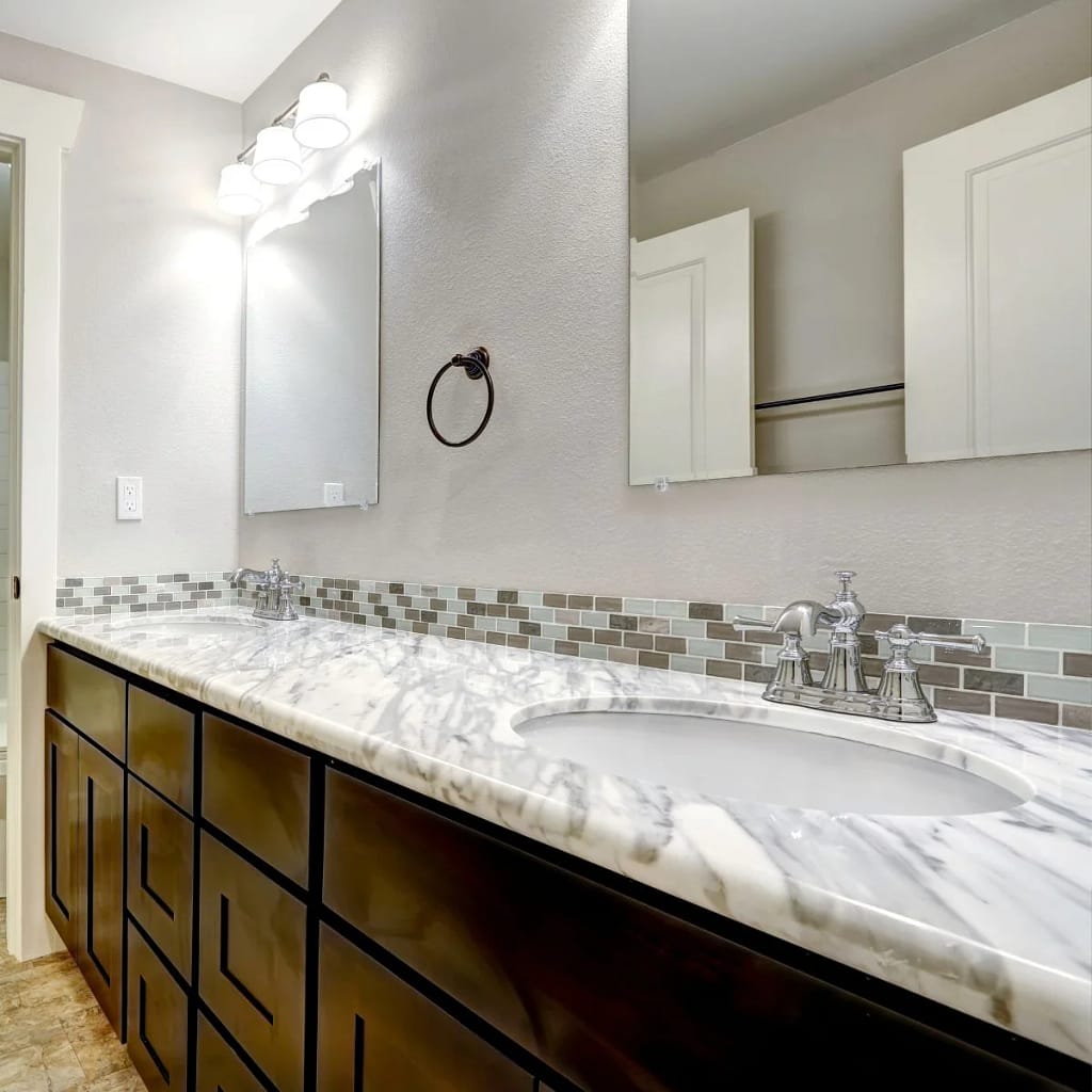 White Granite Vanity Top In Bathroom